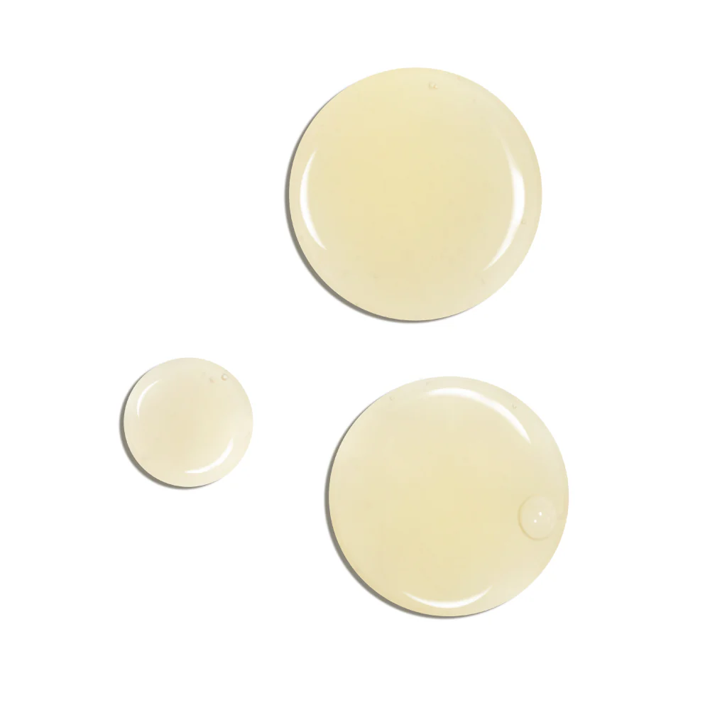 an image of the coola tan face serum on a white background.