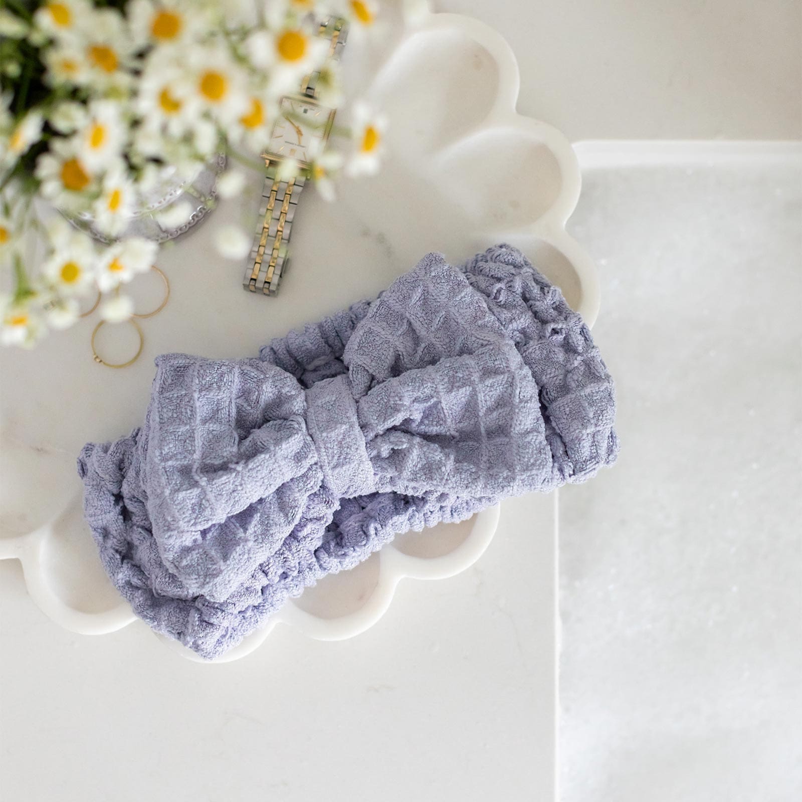 The Pommeshell Spa Headband - keep hair away from your face while cleaning.