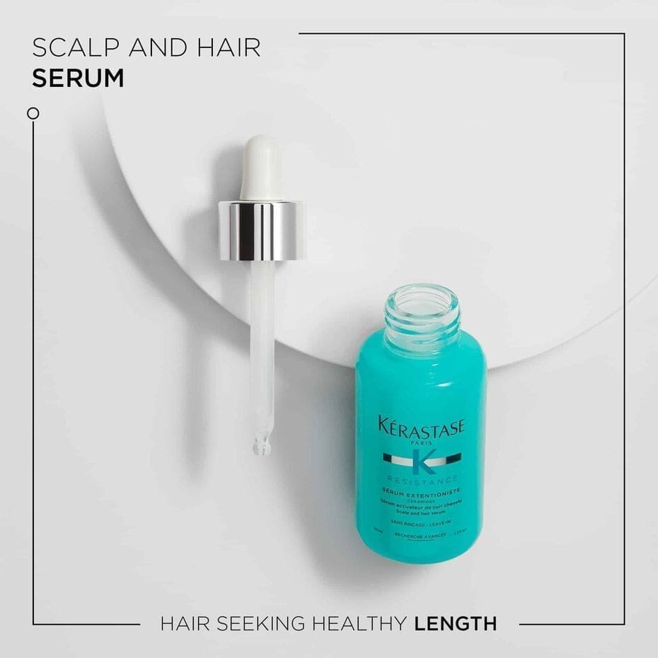 A bottle of kérastase scalp serum on a white background.